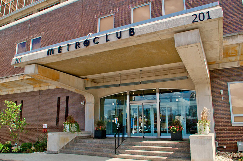 A photo of the main entrance to the Metroclub condominium building.