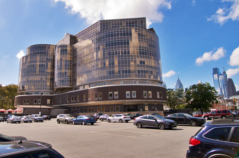 A photo of the Metroclub condominium building's large, secure parking lot. 